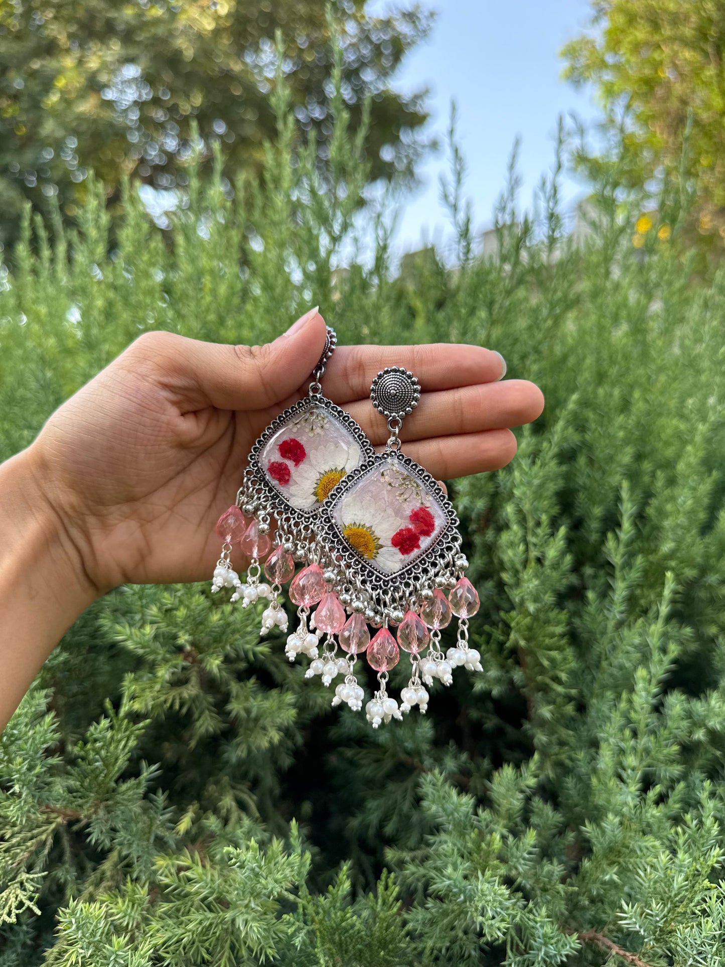 Snow daisy jhumkas